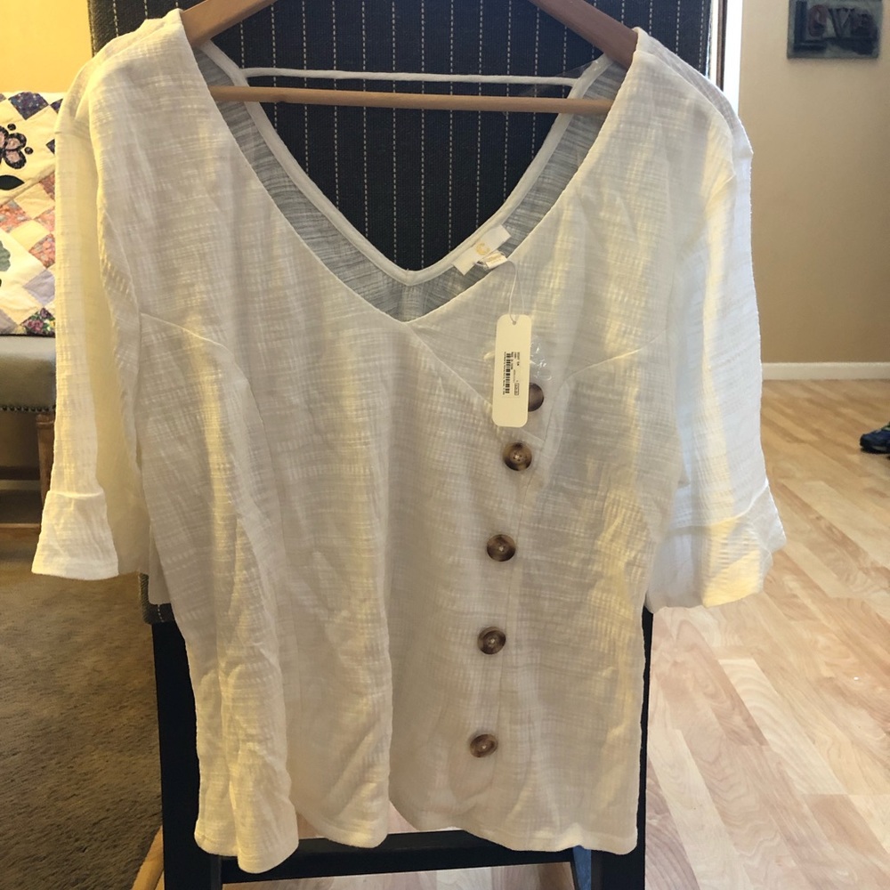 Charming Charlie ivory colored women’s blouse